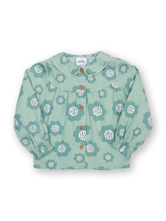 Blusa de algodón orgánico en verde pino suave con estampado "Gran Flor", cuello Peter Pan y botones de coco en la parte frontal.