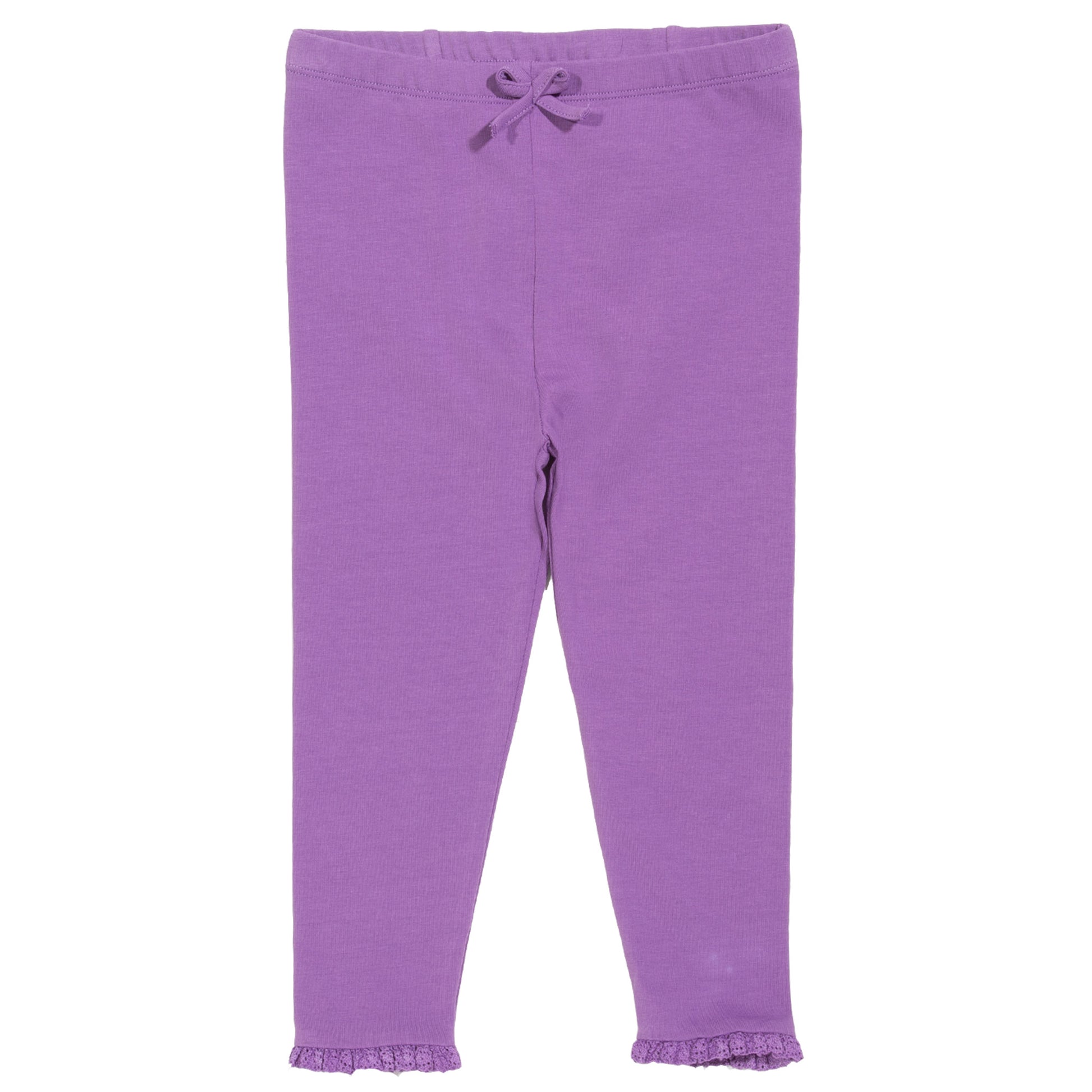 Detalle de vuelitos en los puños de las Calzas con Volantes de algodón orgánico, un diseño femenino y delicado.