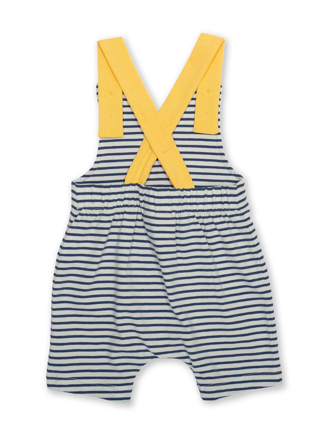 Espalda de la Jardinera Marinera con diseño de rayas azul marino y crema, tirantes amarillos con botones de coco y ajuste cómodo.