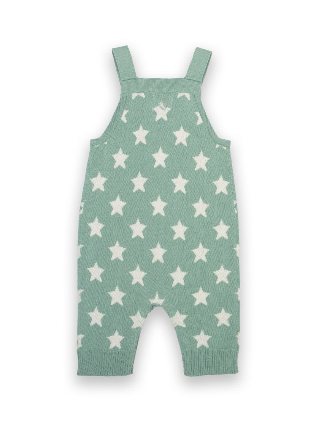 Parte trasera de la jardinera tejida con estrellas, mostrando el diseño continuo en jacquard crema, los tirantes ajustables cruzados y el tejido de punto suave.