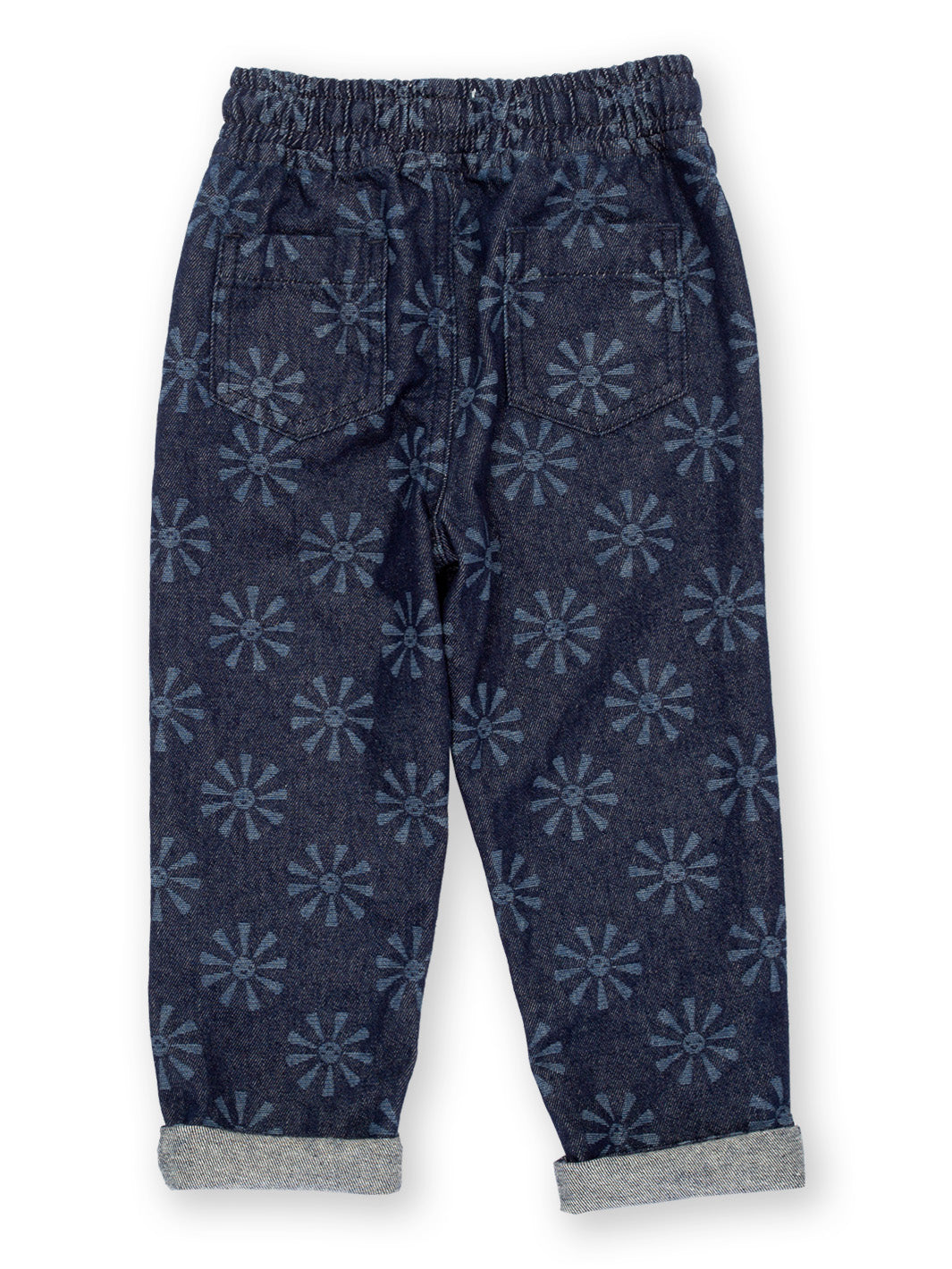 Vista trasera de jeans infantiles con estampado de soles sonrientes, confeccionados en algodón orgánico, con dobladillos volteados y tela lavada con enzimas de manzana.