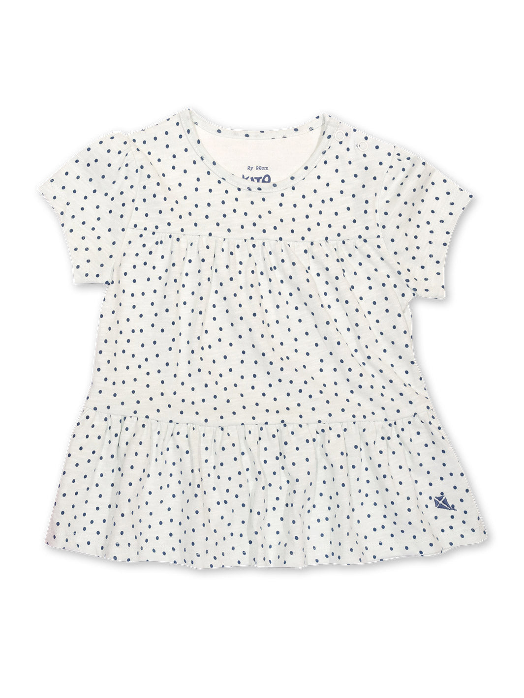 Polera Pequeños Lunares de algodón orgánico, color crema con estampado de puntos y dobladillo con volantes.