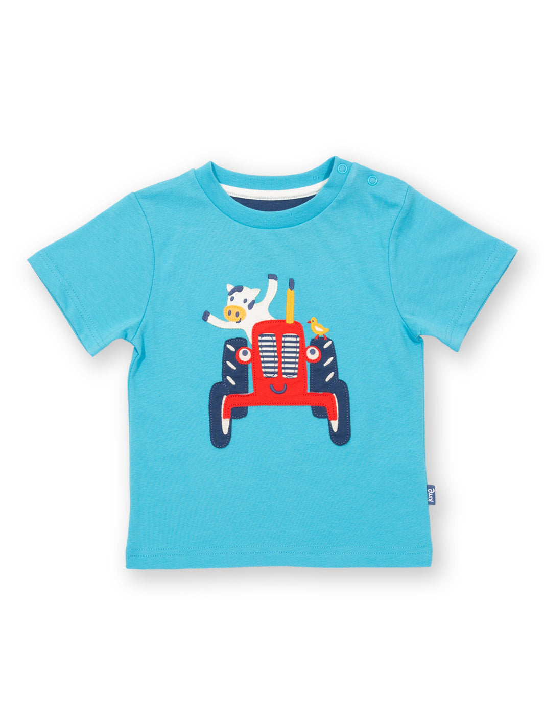 Polera Vaca Tractorista de algodón orgánico, color celeste con aplique de tractor y vaca y manga corta.