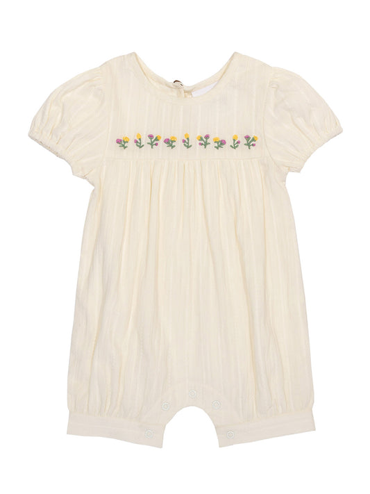 Enterito Pequeño Brote de algodón orgánico, color crema con bordado de flores y mangas fruncidas.