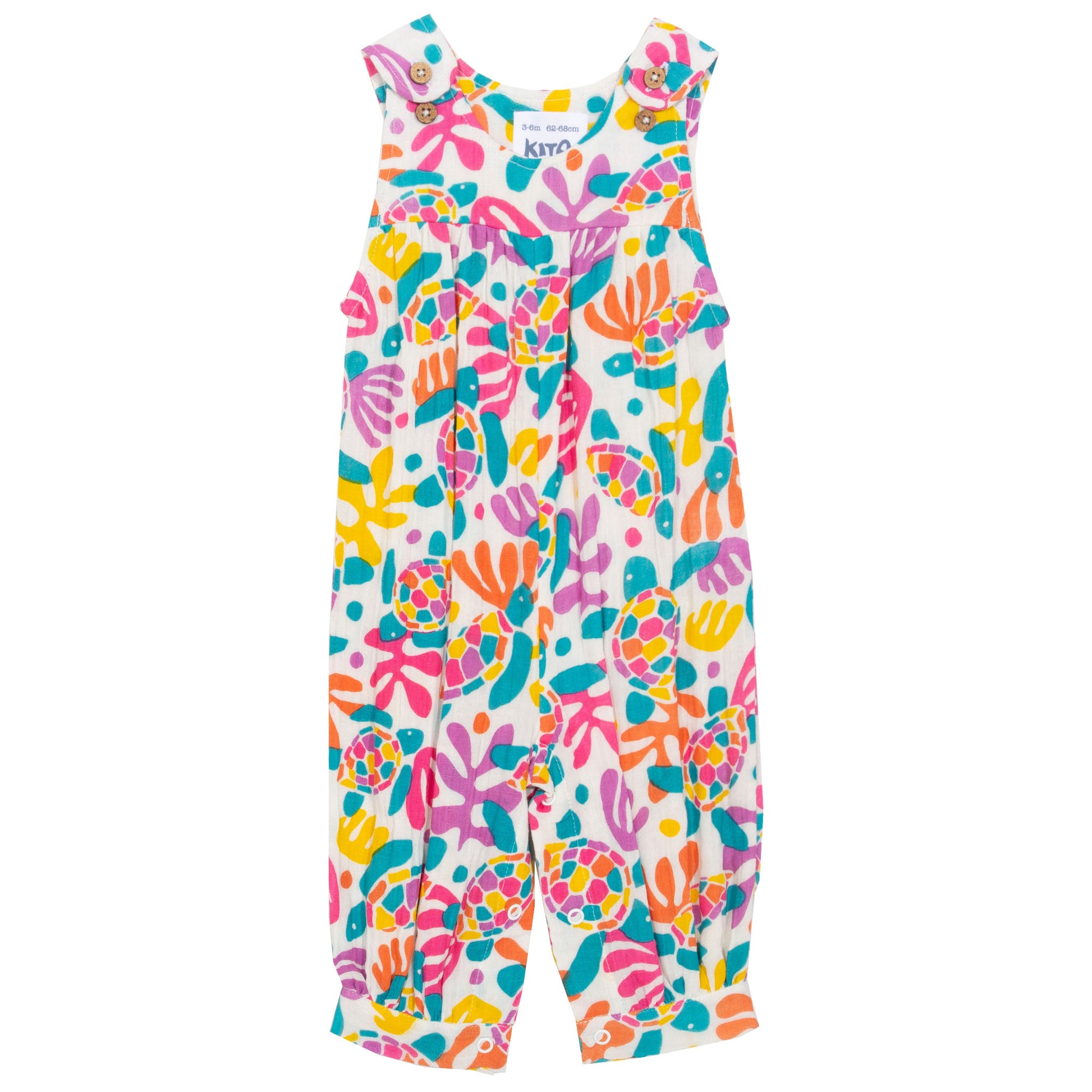 Jardinera infantil de algodón orgánico con estampado de tortugas y tirantes ajustables.