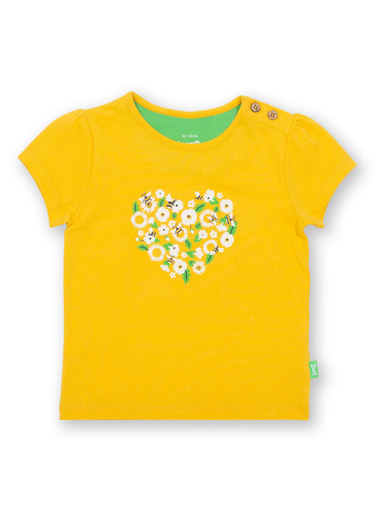 Polera Corazón Floral de algodón orgánico color amarillo con estampado de flores y abejorros.