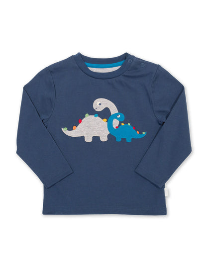 Polera Dino Amigos de algodón orgánico, en azul marino con apliqué de dinosaurio y espinas de arcoíris.