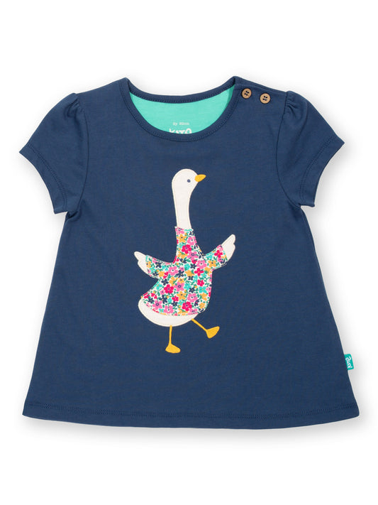 Polera Gansito Floral de algodón orgánico, azul marino con aplique de ganso y estilo túnica.