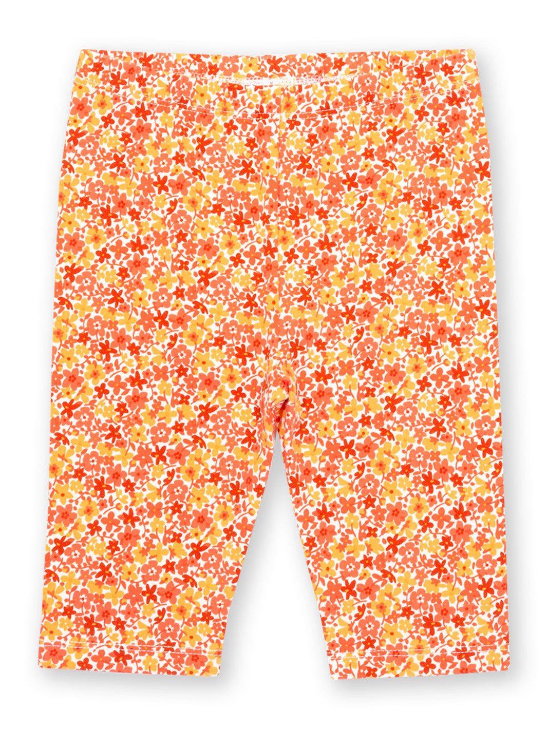 Calzas 3/4, de algodón orgánico con estampado de flores naranjas, diseño fresco y primaveral.