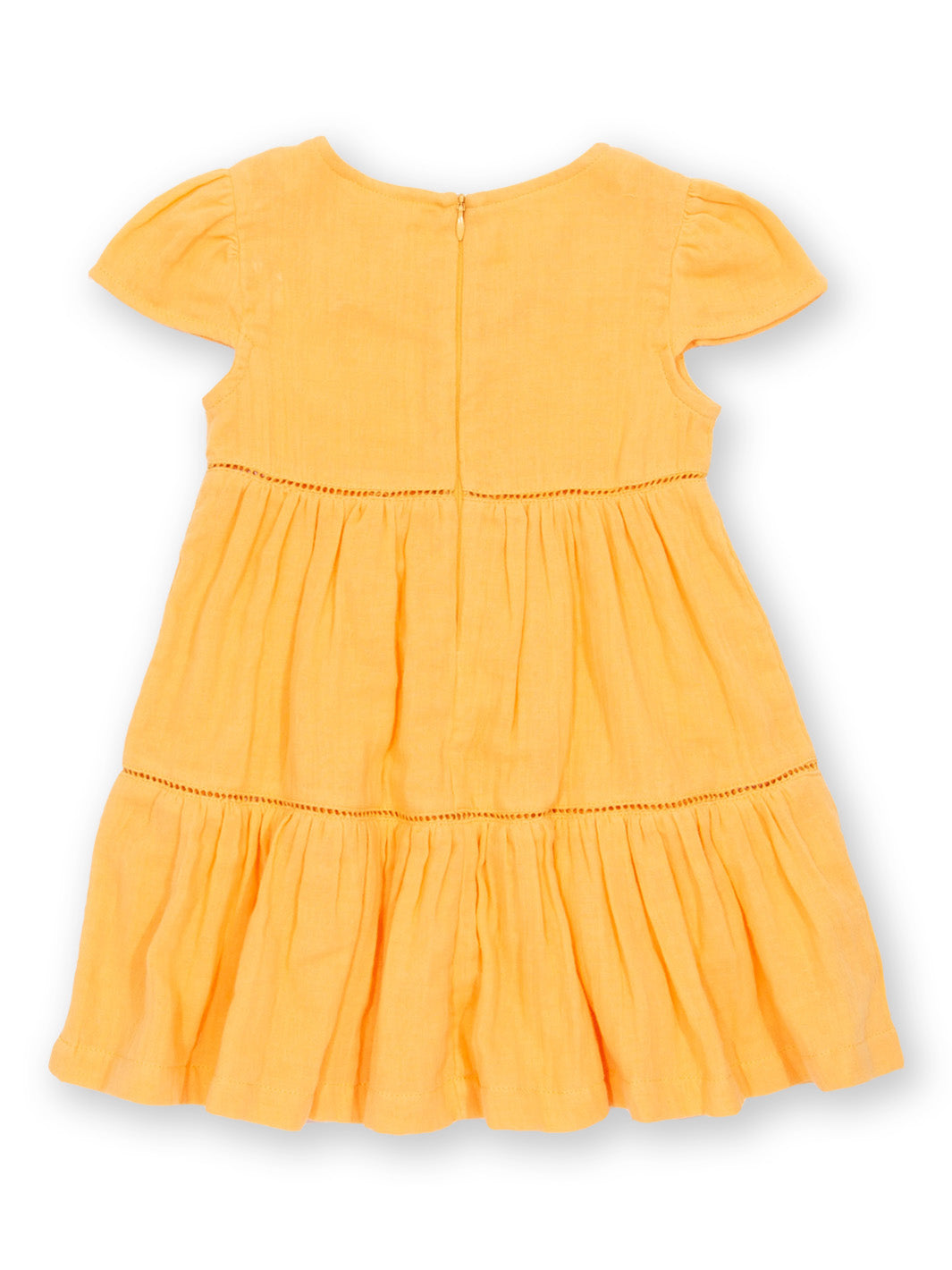 Vista trasera del Vestido Atardecer de algodón orgánico, con tela de muselina de doble capa y falda fluida.