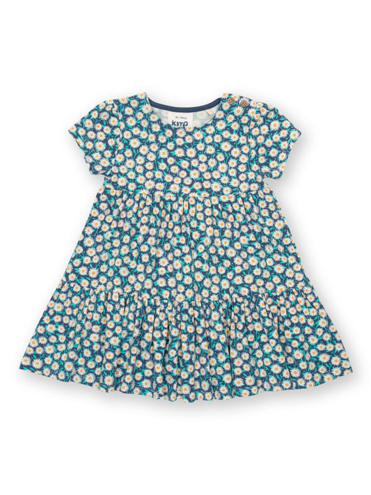 Vestido Campo Floral de algodón orgánico, en azul marino con estampado de flores y falda escalonada