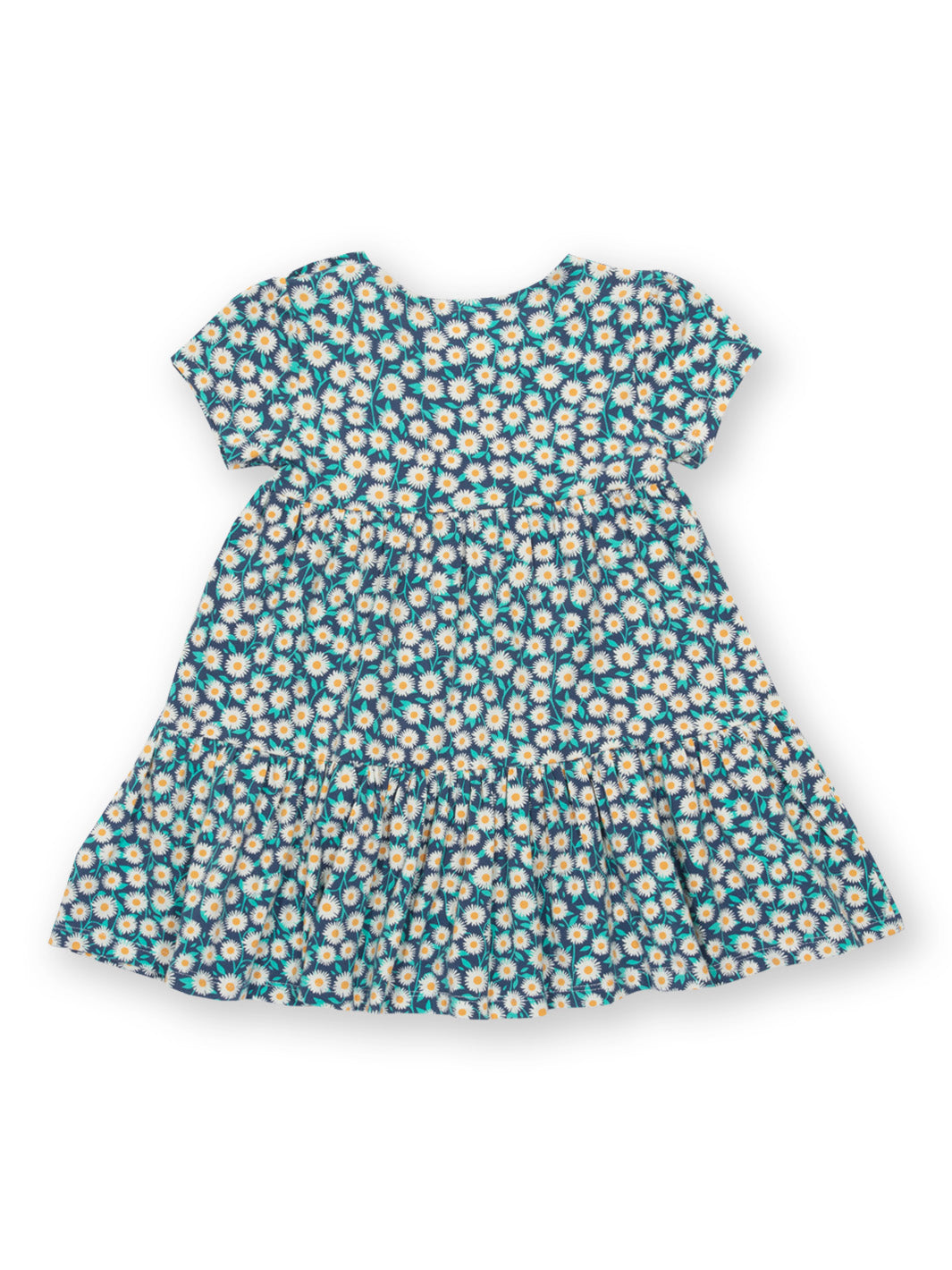 Vista trasera del Vestido Campo Floral de algodón orgánico, con falda escalonada para mayor movimiento.