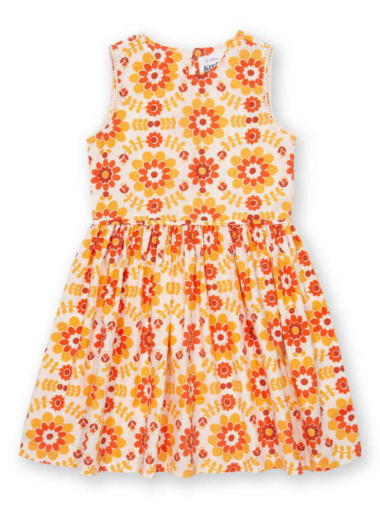Vista frontal del Vestido Retro de algodón orgánico, con estampado floral en tonos amarillos y naranjas sobre popelina ligera.